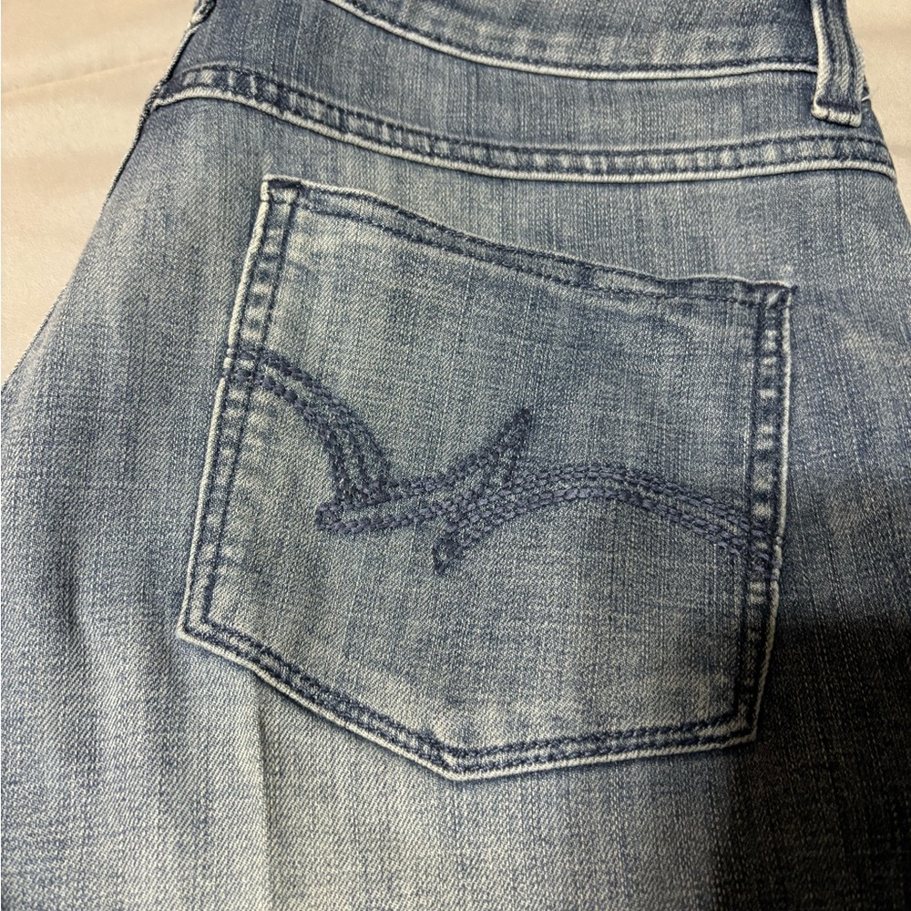 Wrangler Blue Boot Cut Jeans with Classic Distressed Look - Picture 2 of 6
